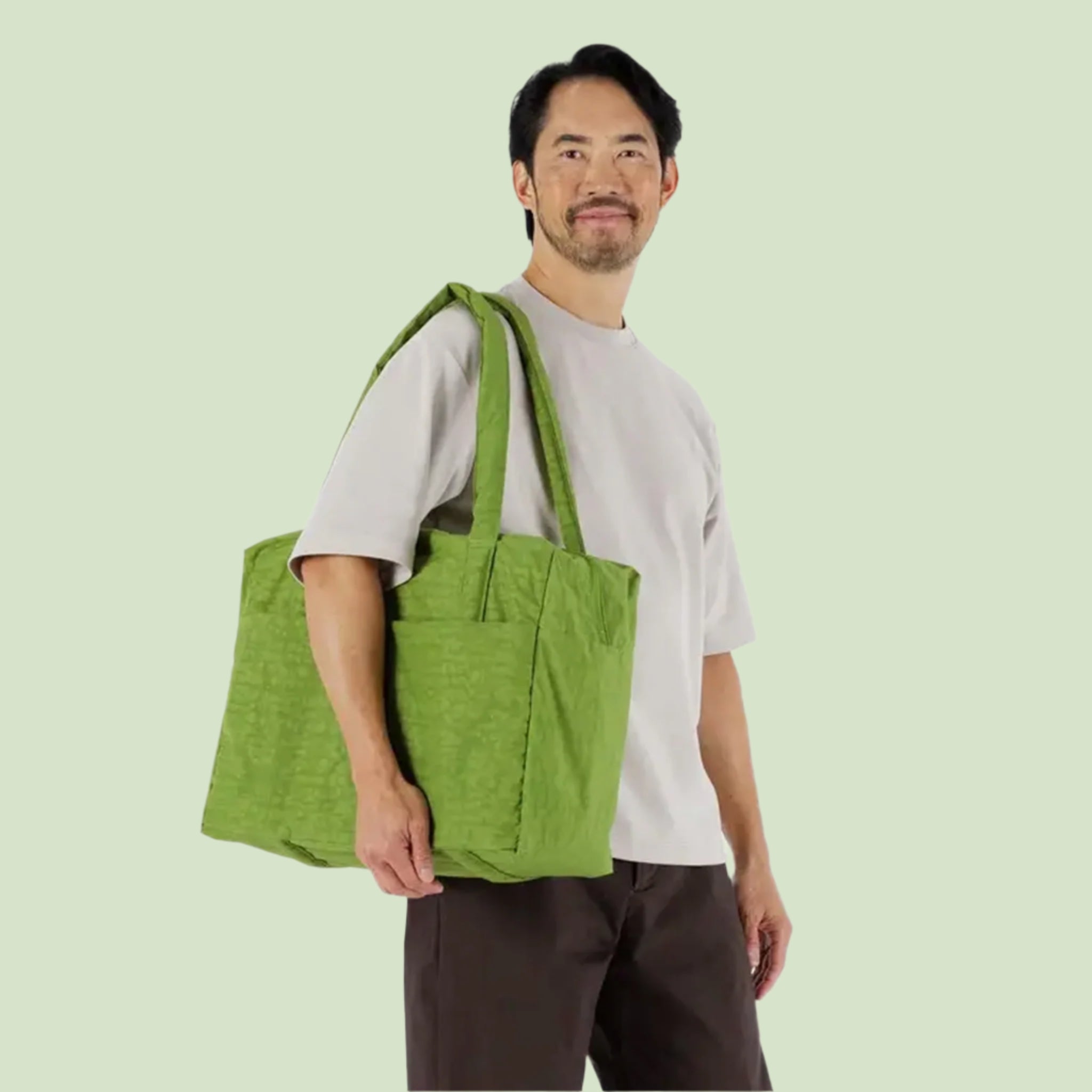 A vibrant green puffer tote bag. 