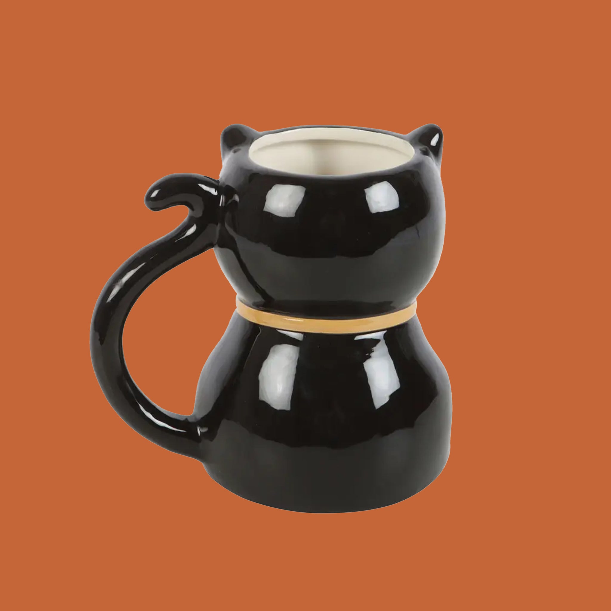 A black cat shaped ceramic mug. 