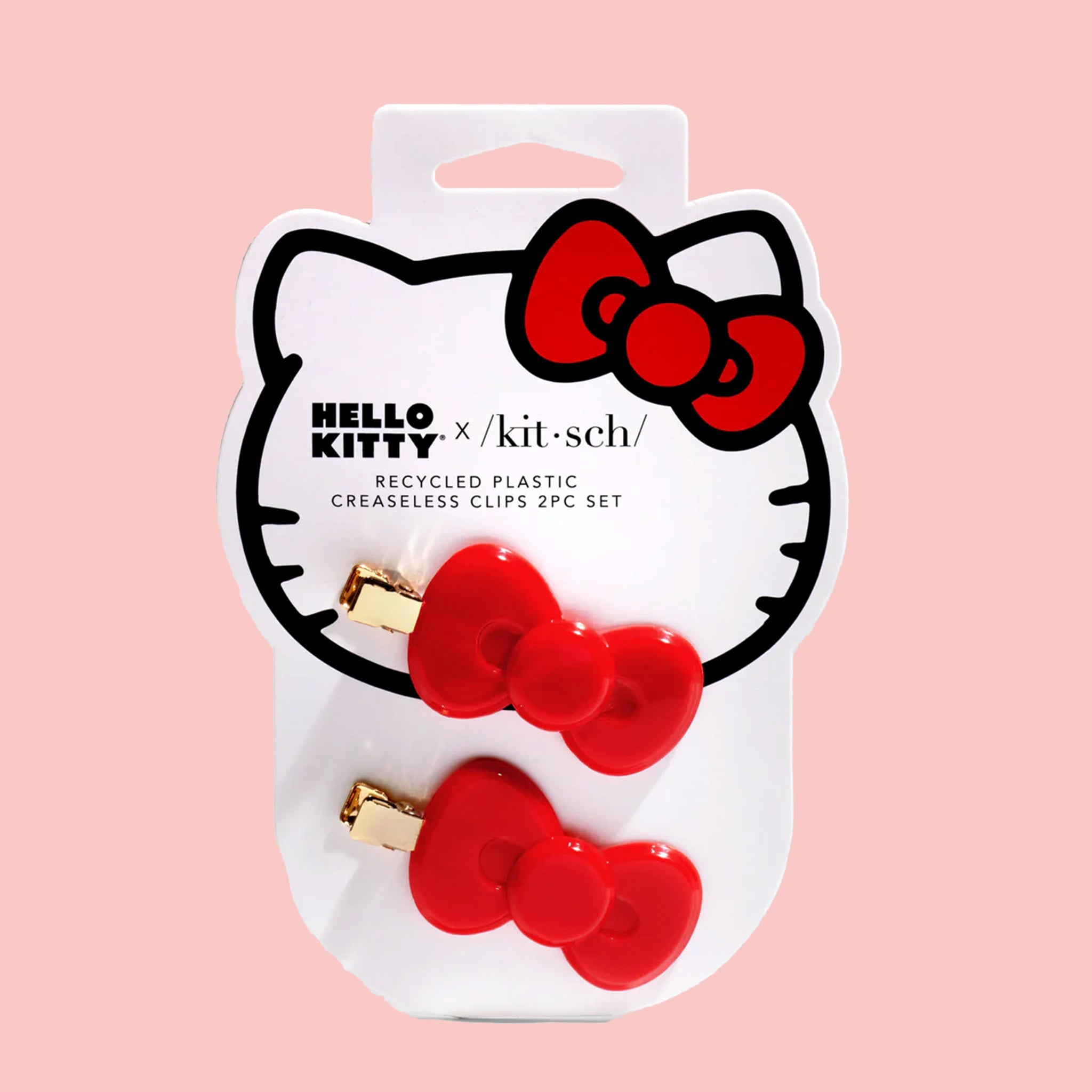 A set of two hair clips shaped as Hello Kitty's iconic red bow. 