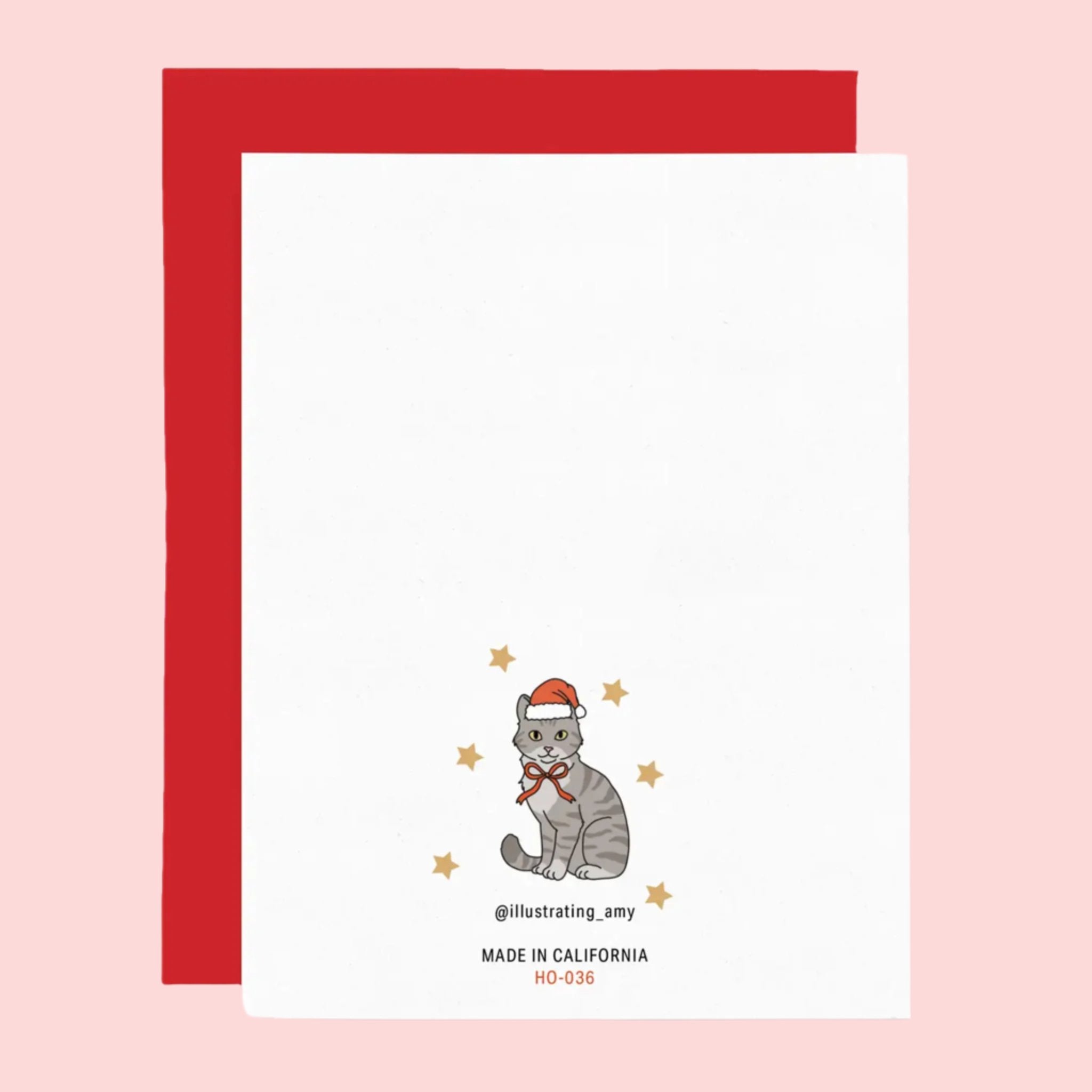 A white card with a variety of different colored and sized cat illustrations dressed in festive accessories and text at the top that reads, &#39;Happy Holidays&#39;. 