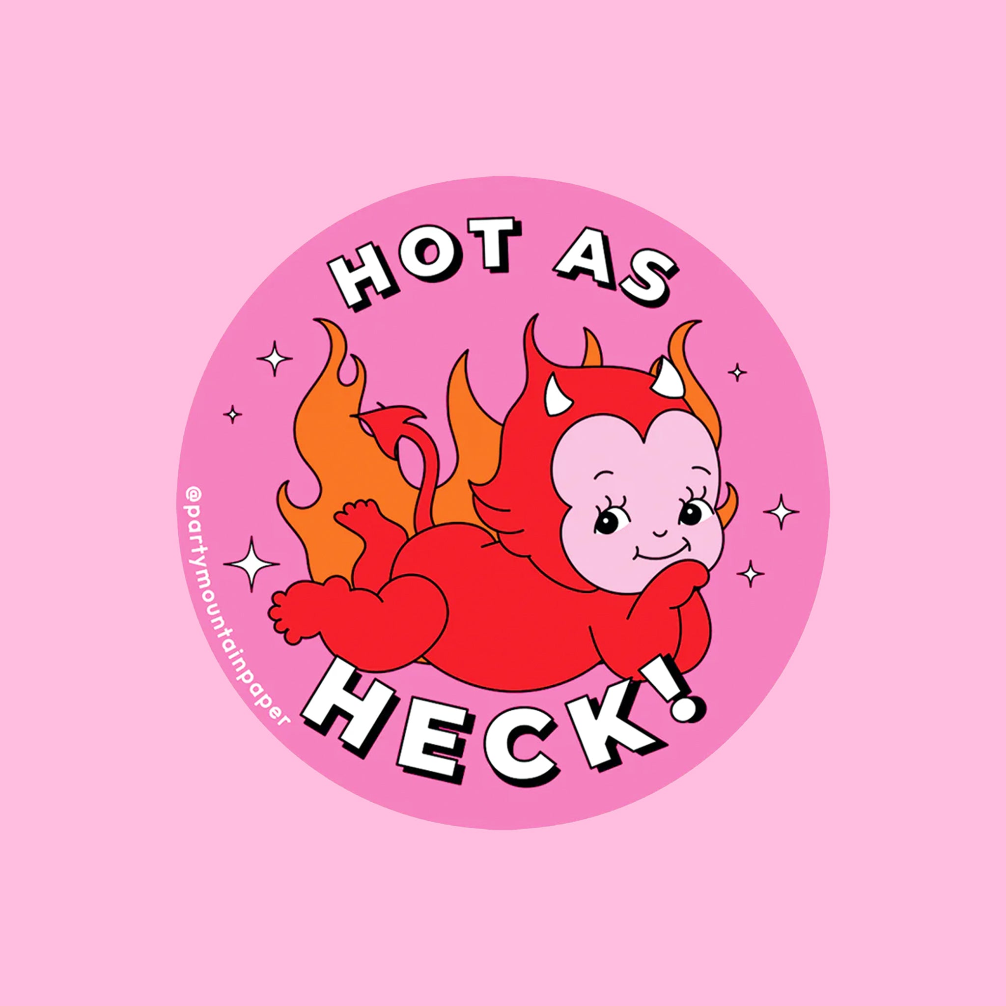 On a pink background is a hot pink sticker with a red devil graphic on the front and text above and below that reads, "Hot As Heck". 