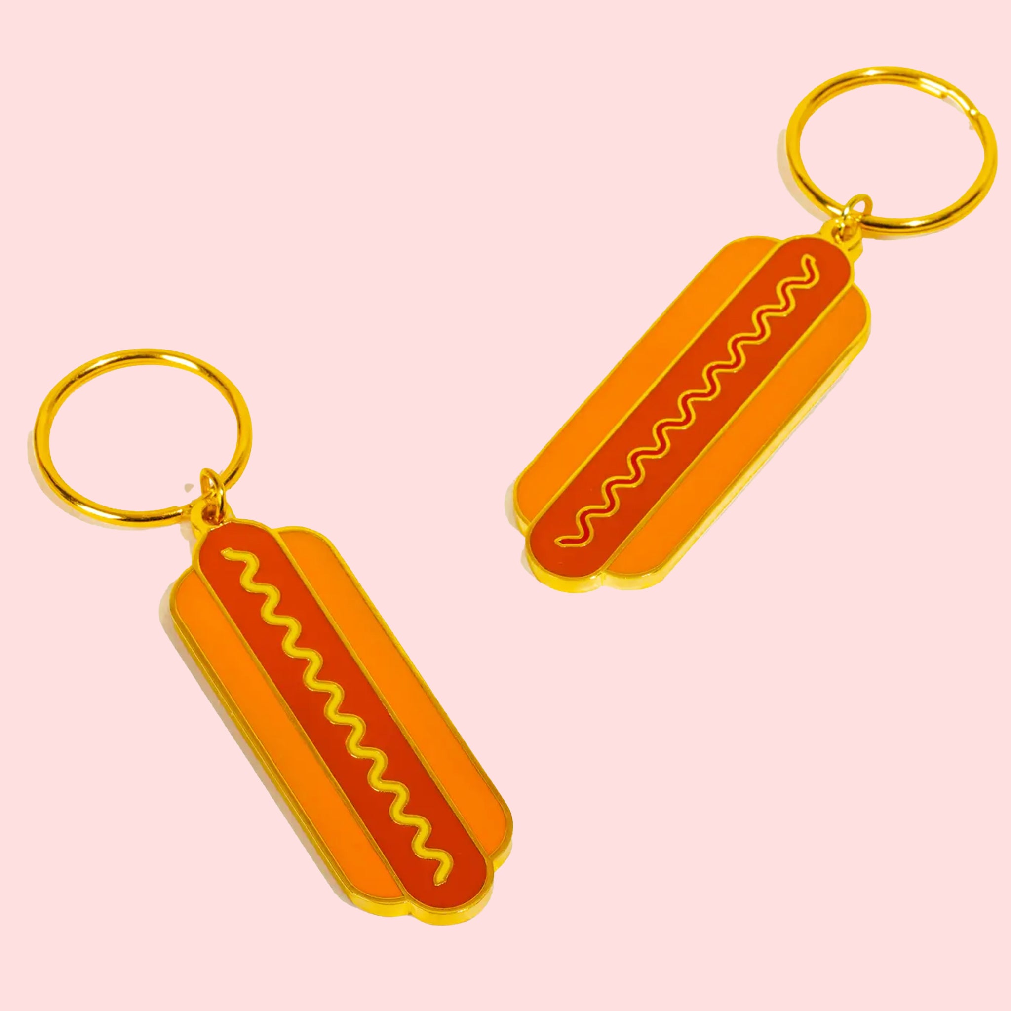 A hot dog shaped keychain with two sides. One keychain per purchase. 