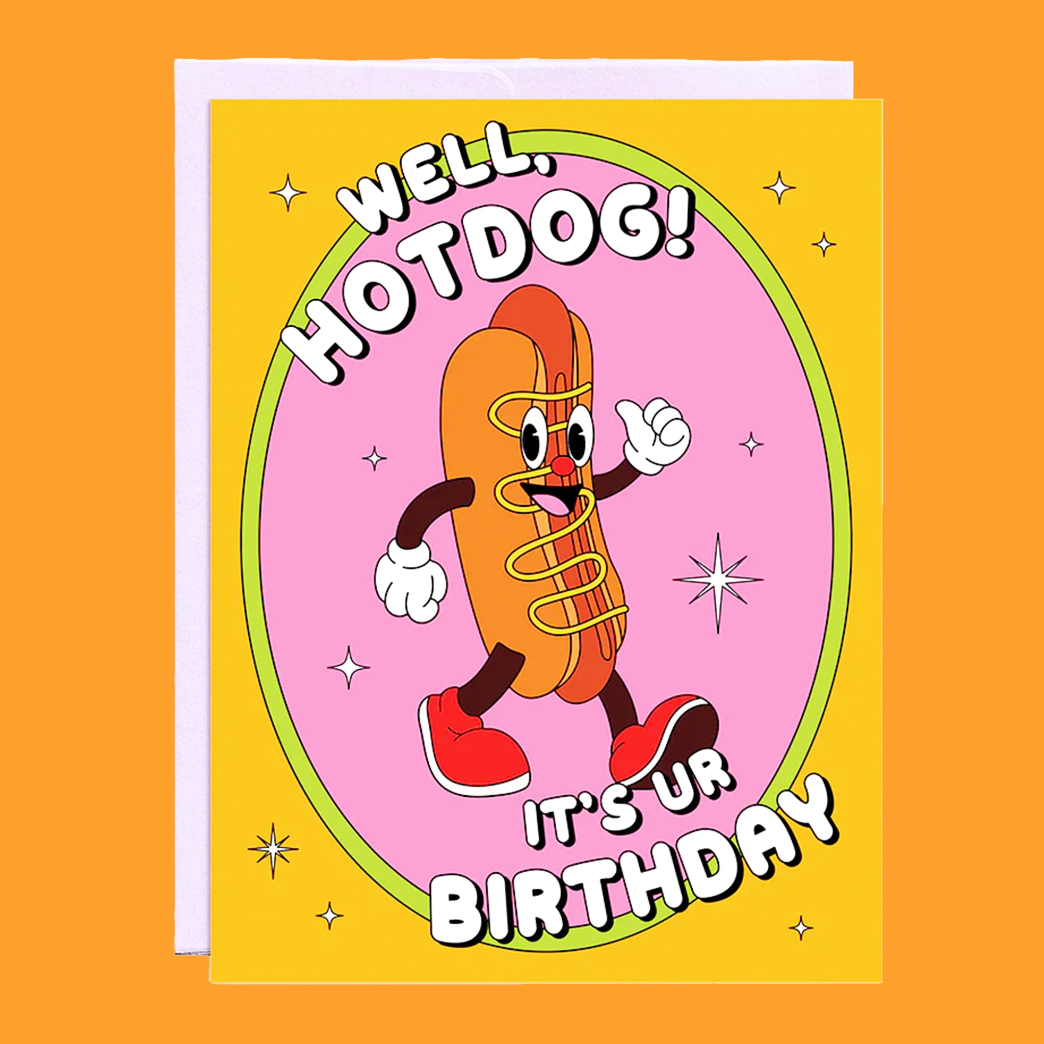 On an orange background is an orange and pink card with an illustration of a smiley face hot dog with text above and below that reads, &quot;Well, Hotdog! It&#39;s Ur Birthday&quot;.