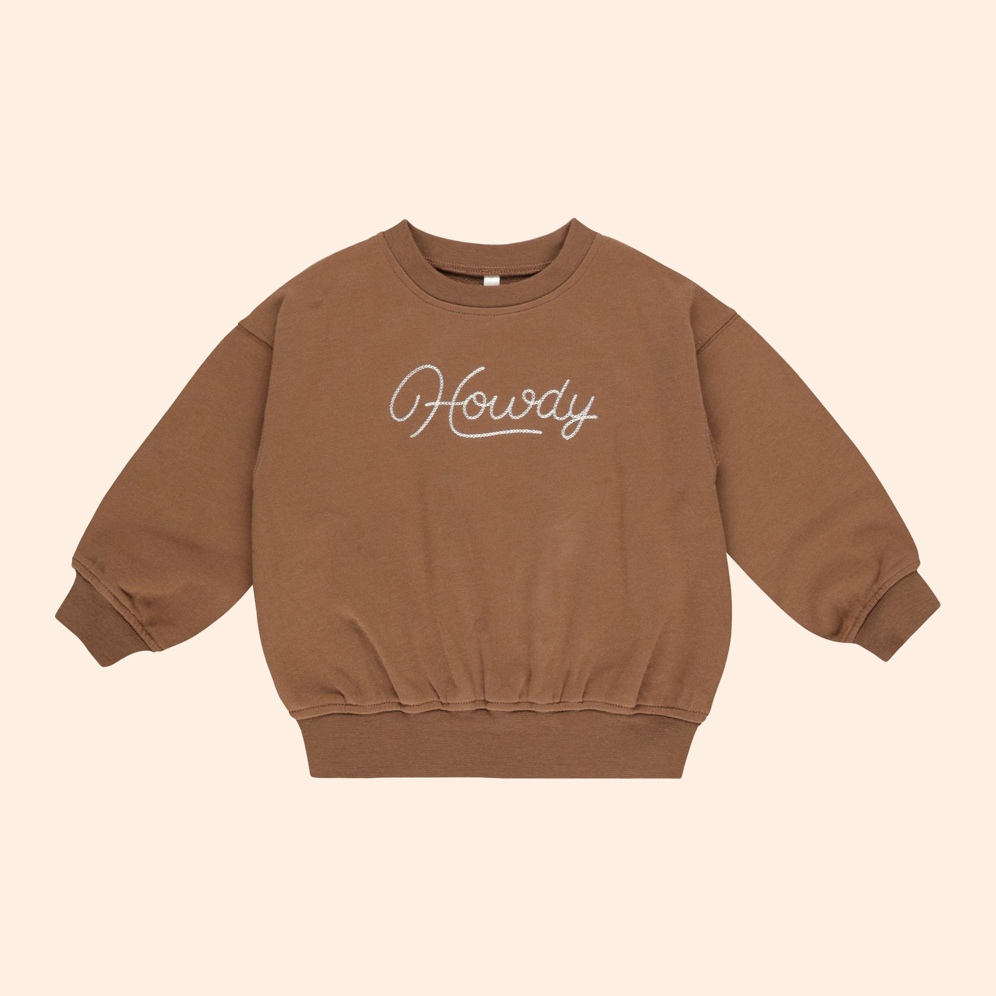 A brown crewneck sweatshirt with embroidered text that reads, "Howdy". 