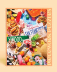 On a light orange background is a puzzle box that has images of the iconic state of California including, green juices, sunglasses, animal style burgers and fries, tacos, a Hollywood street sign and more.