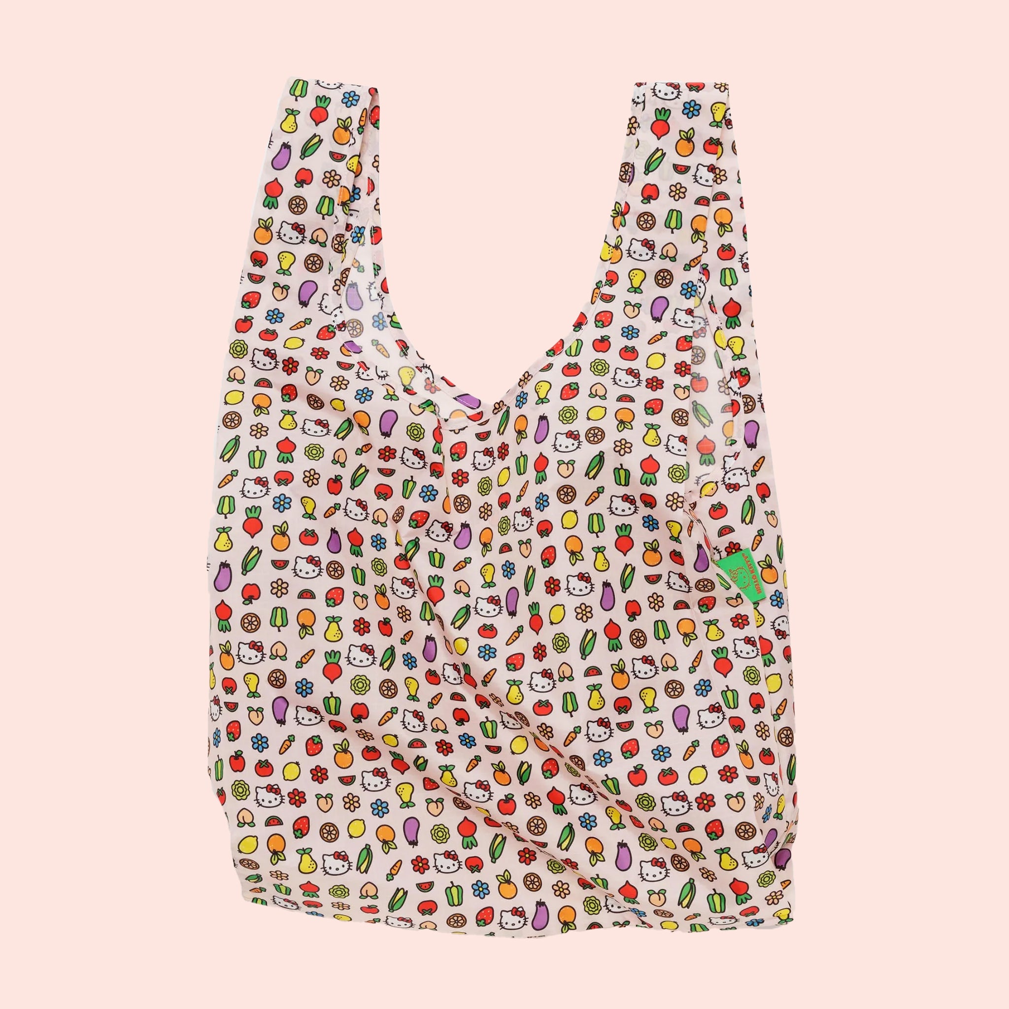 A multi colored nylon bag with two handles and hello kitty icon graphics all over.