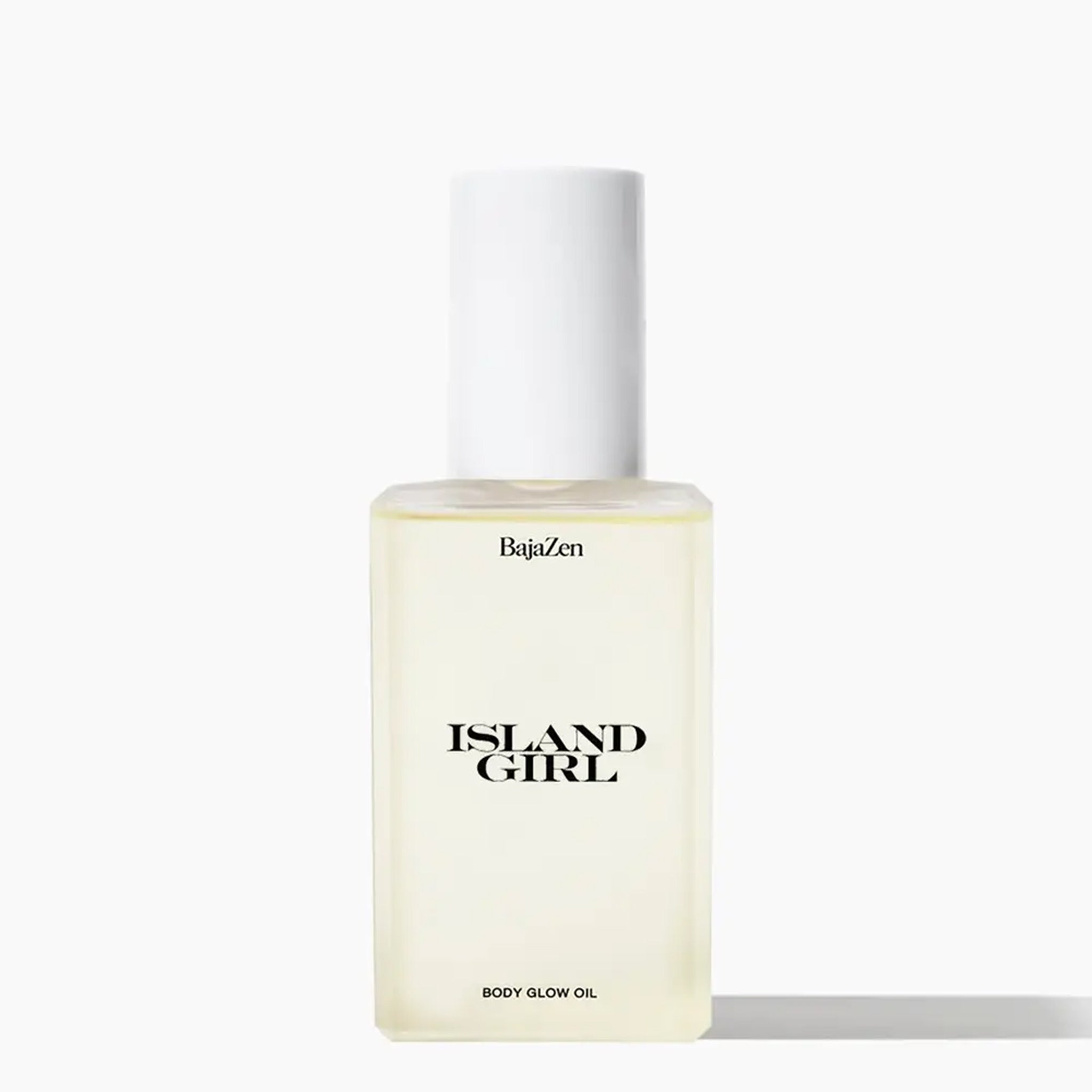 A clear container of body glow oil with a white pump lid and black text that reads, &quot;Island Girl&quot;.