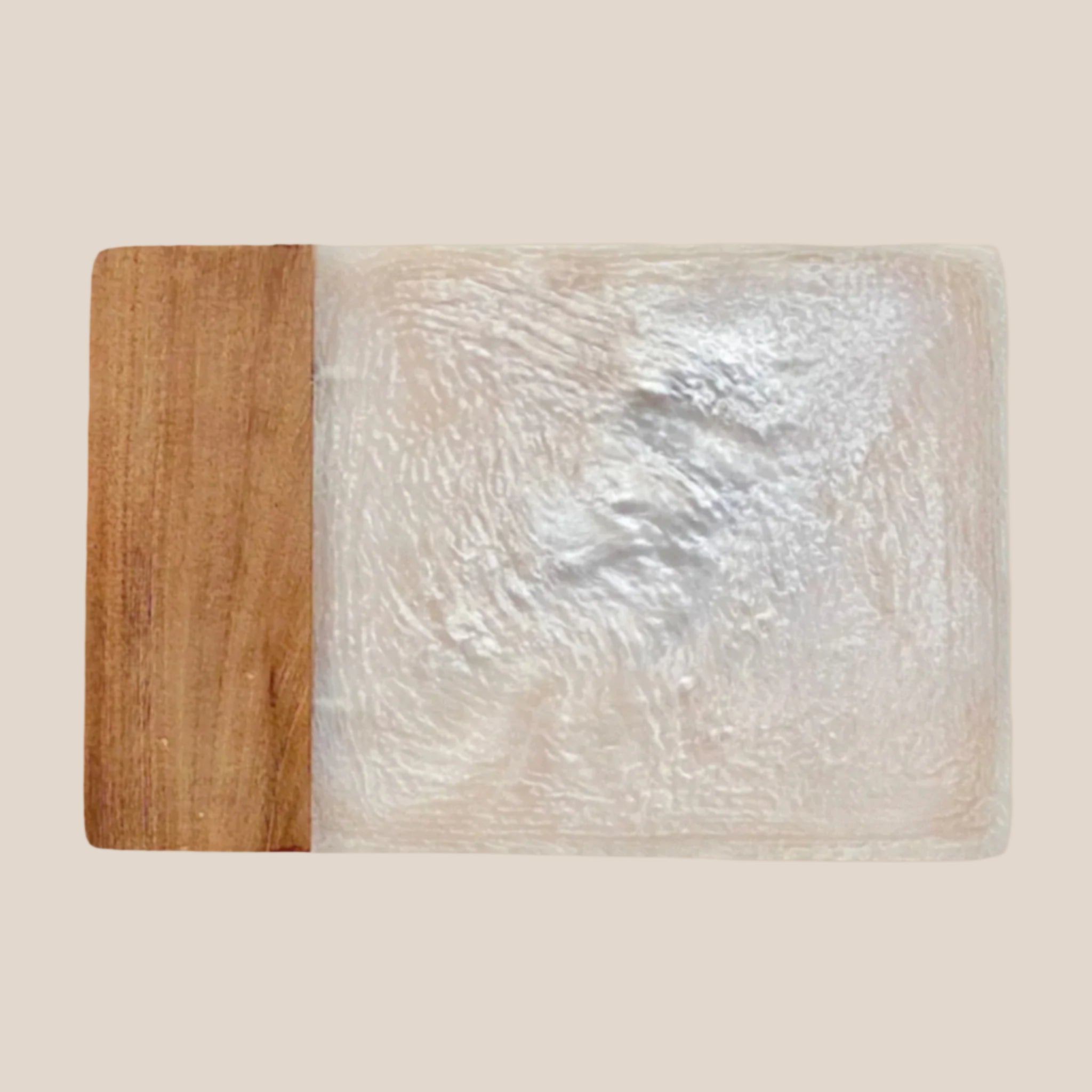 An ivory resin and wood cheese board. 