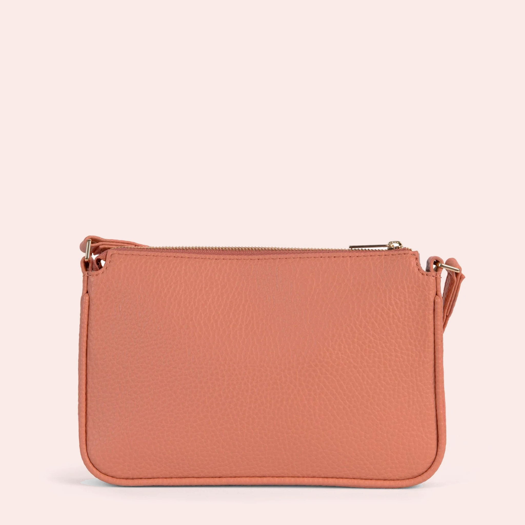 backside view of a coral pink crossbody bog