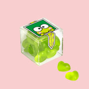 An acrylic box of green heart shaped candies with a graphic of Keroppi on the front. 