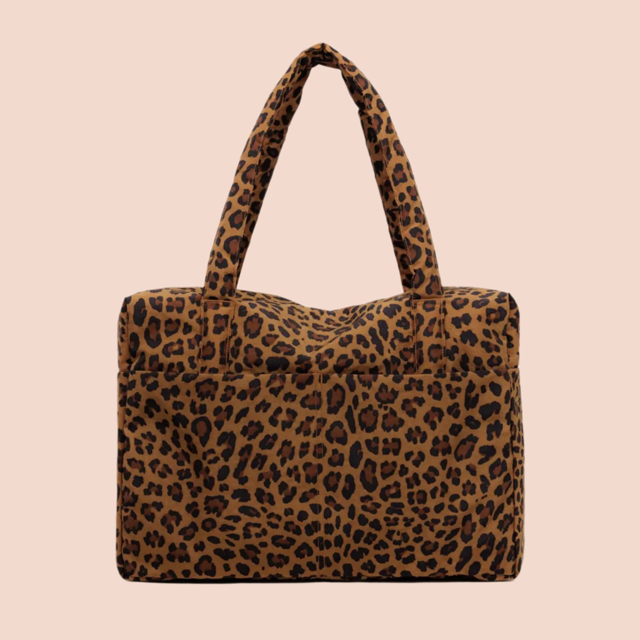 A brown and black leopard printed puffer carry on tote bag. 