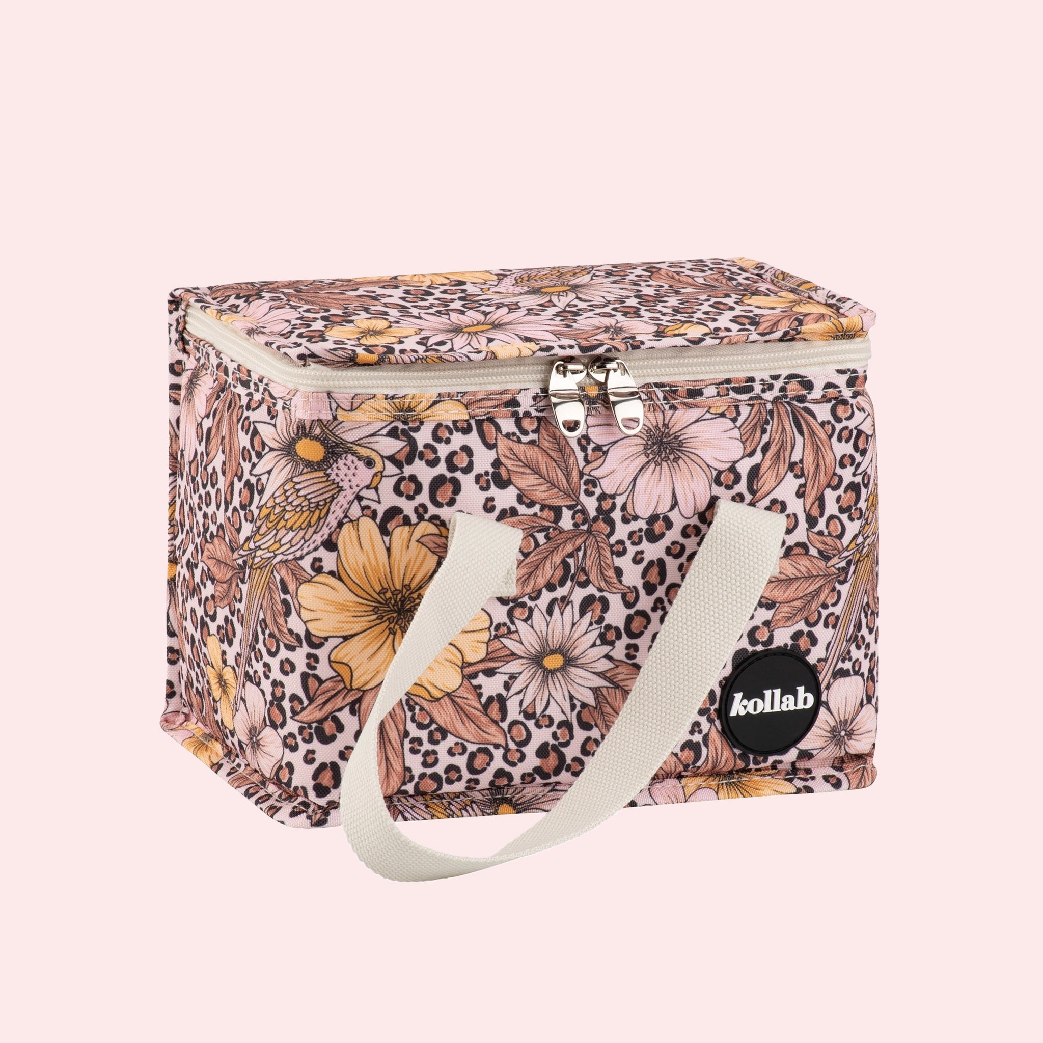 A leopard floral print lunch box with ivory straps. 