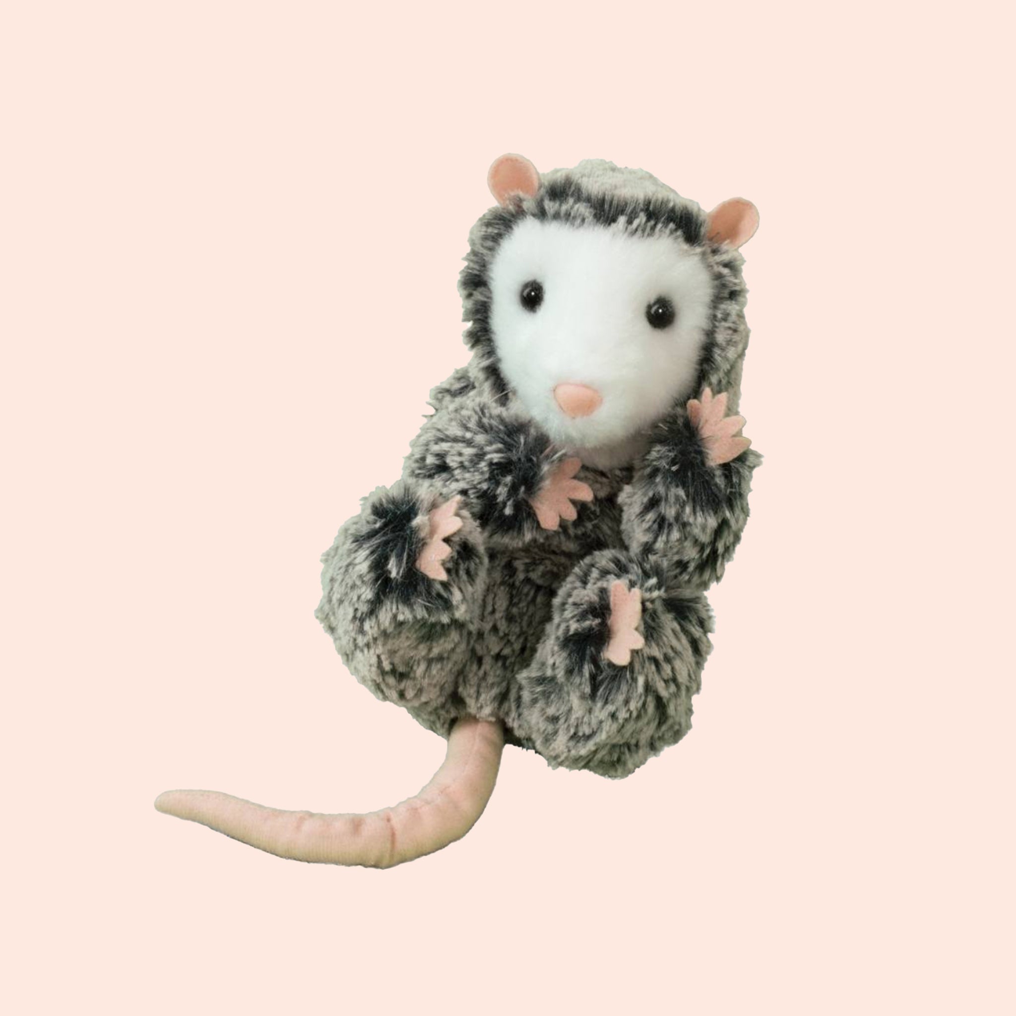 Excessively cute stuffed baby possum covered in ashy fur with frosted tips and pale pink paws, ears, nose and tail. The possum has a solid white face and a pair of black, gleamy eyes.