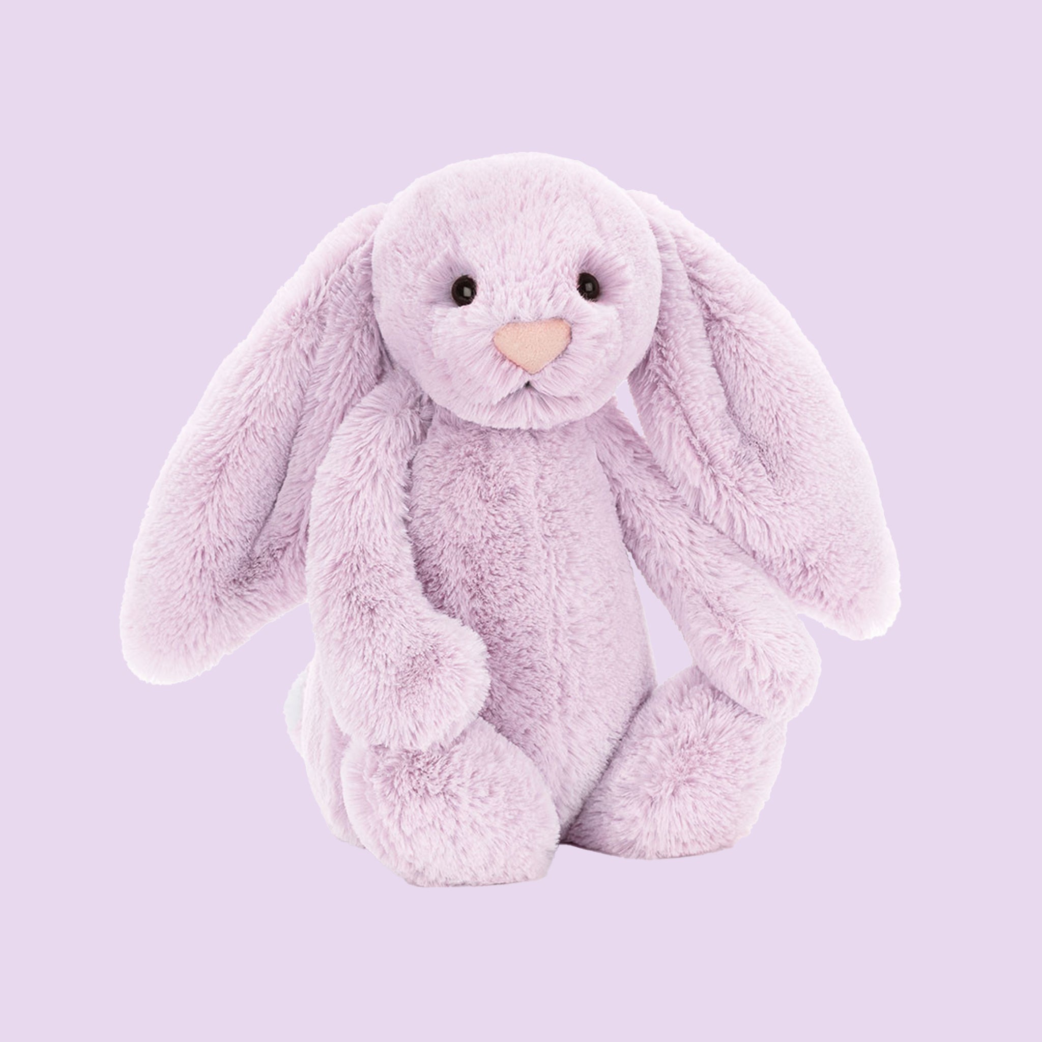 A lilac colored bunny stuffed animal toy.