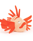 On a white background is orange lionfish shaped stuffed toy. 