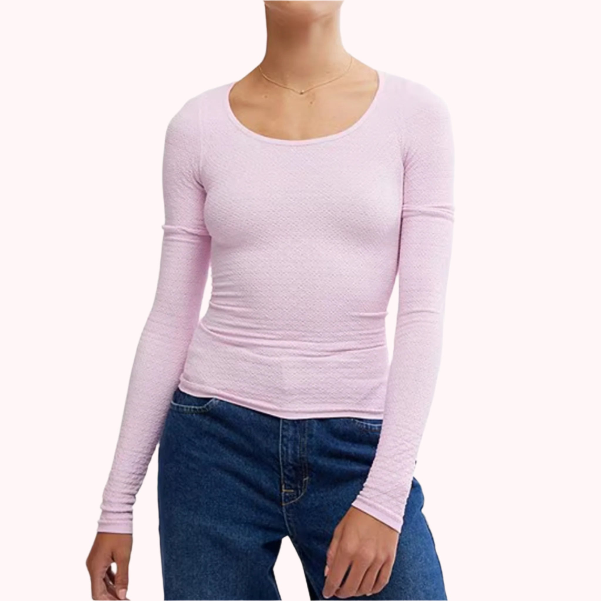 A pink long sleeve scoop neck shirt with a subtle texture. 