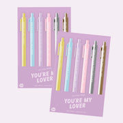 A pen set with six pens each with different Taylor Swift song lyrics. 