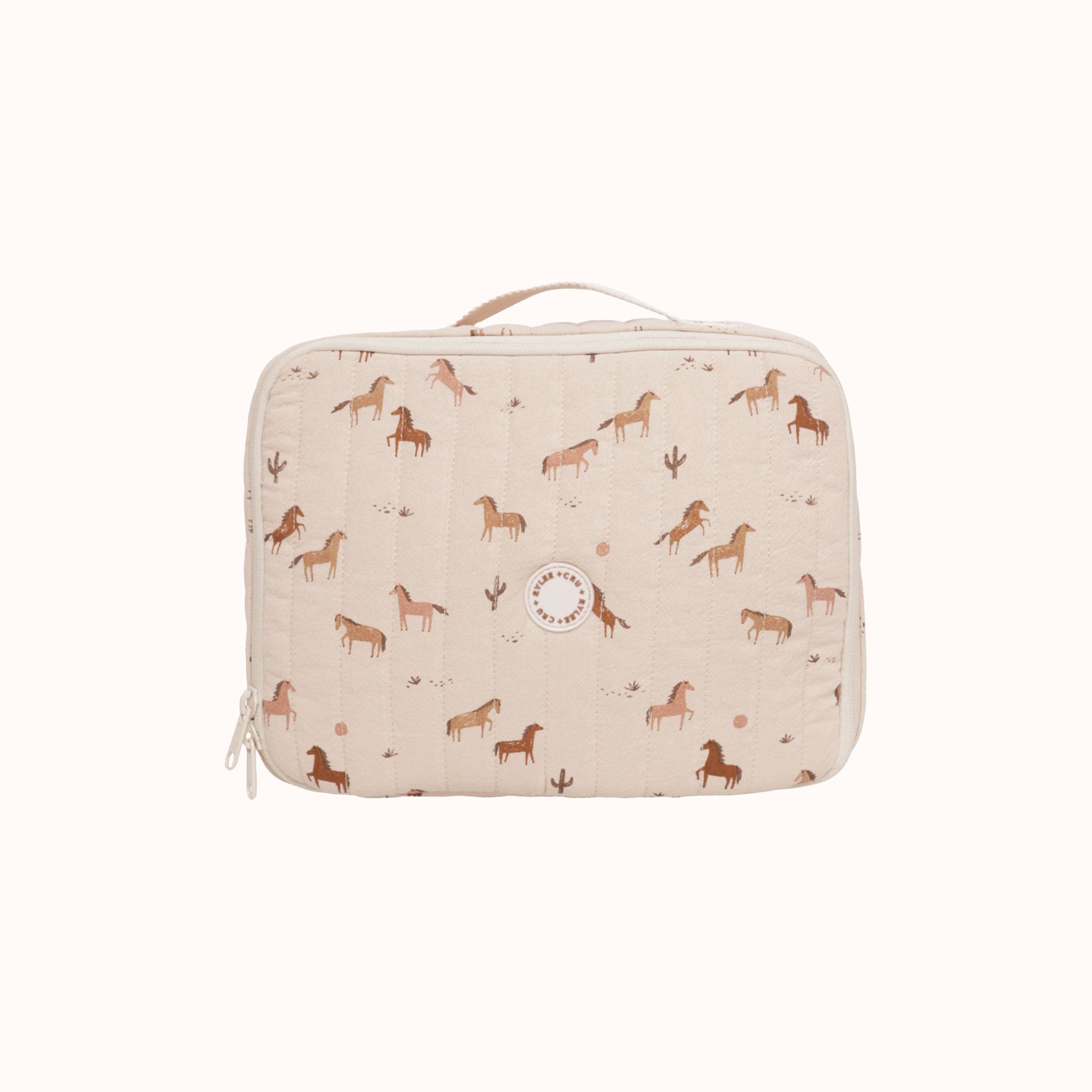 A light pink lunch box with a horse print. 