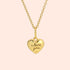 A gold heart shaped pendant necklace with 'i love you' engraved on the back. 