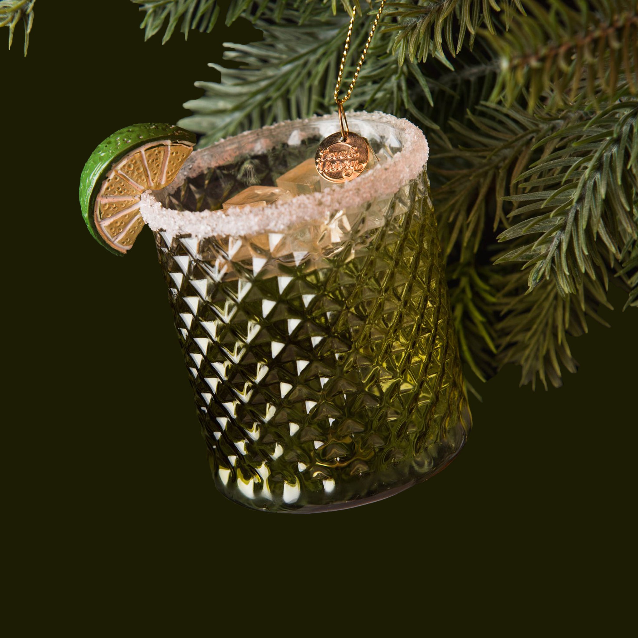 A glass margarita shaped ornament with a salt rim and lime slice. 