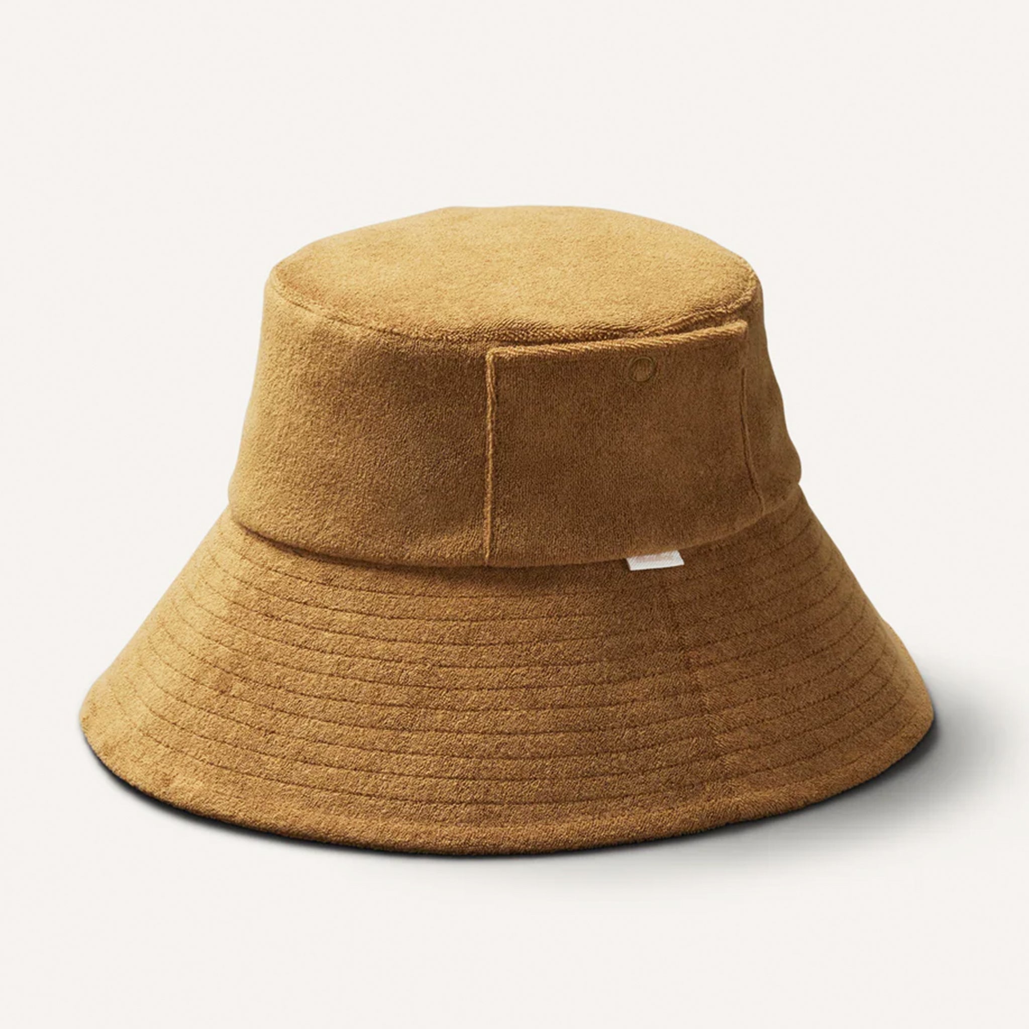 A brown bucket hat with a ribbed brim and removable draw string. 