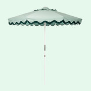 A green and darker green lined umbrella.