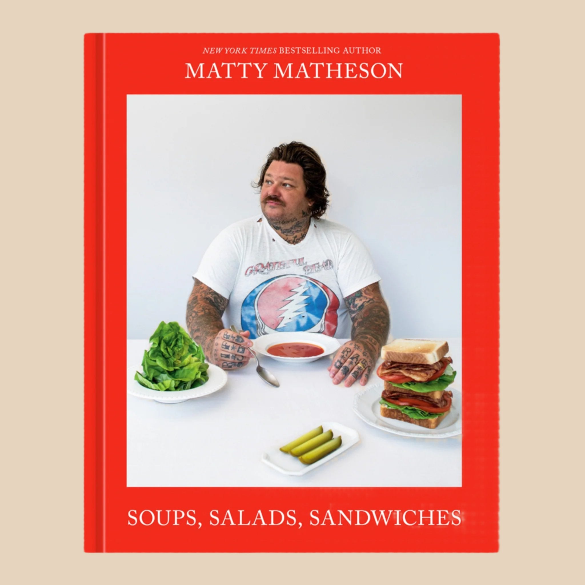 A red book cover with Matty Matheson on the front and text that reads, 'Soups Salads Sandwiches'.