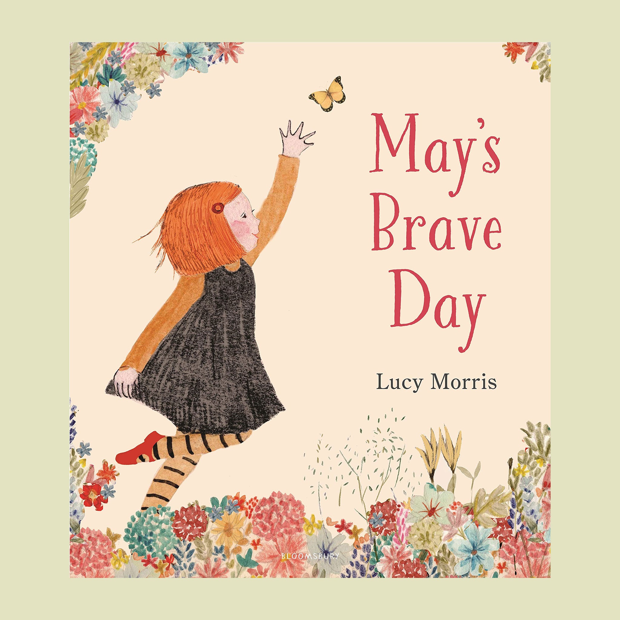 On a green background is a ivory book cover with an illustration of a little girl reaching for a yellow butterfly and text on the right side that reads, "May's Brave Day". 