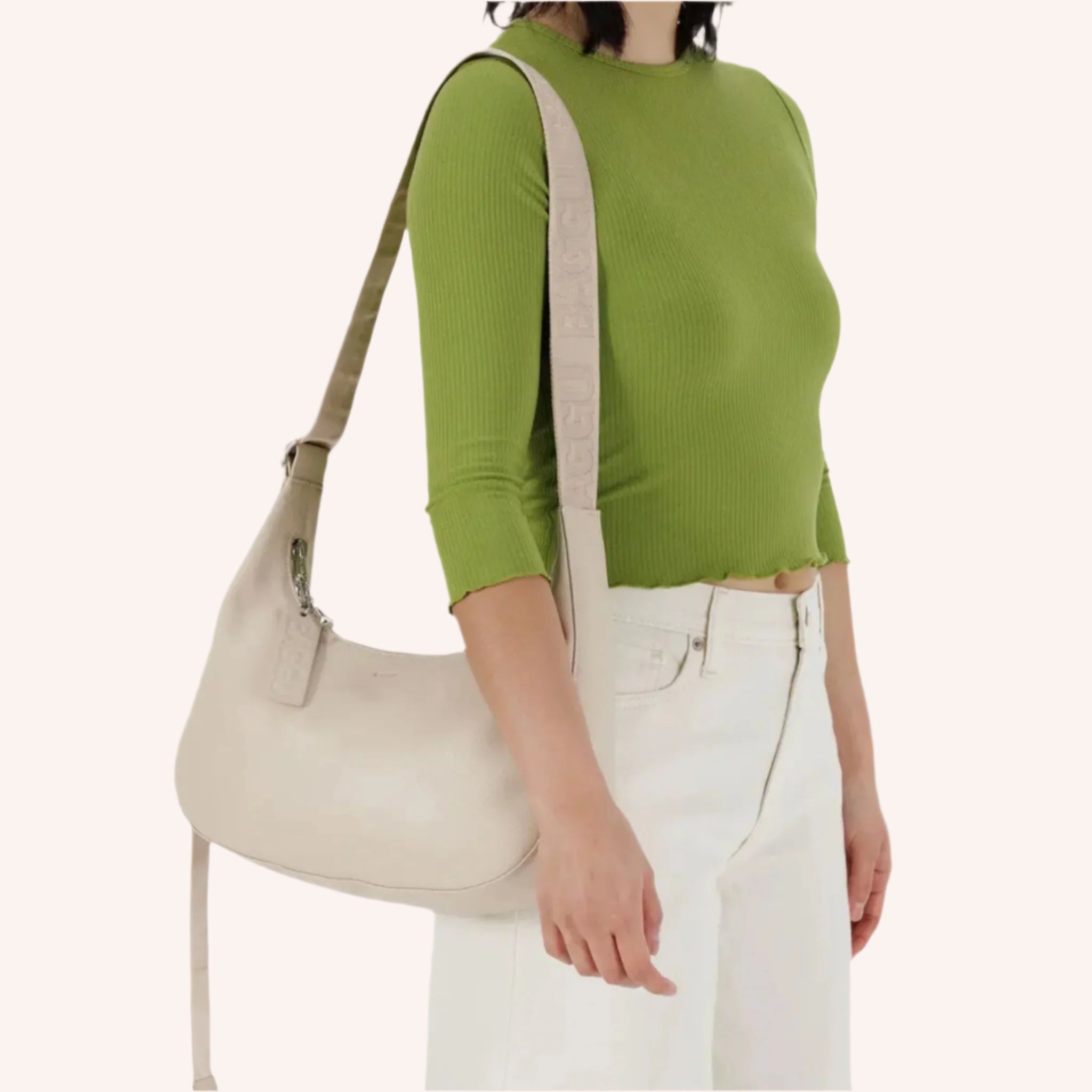 A neutral leather shoulder bag in an off white cream shade. 