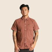 A reddish brown short sleeve button up shirt. 