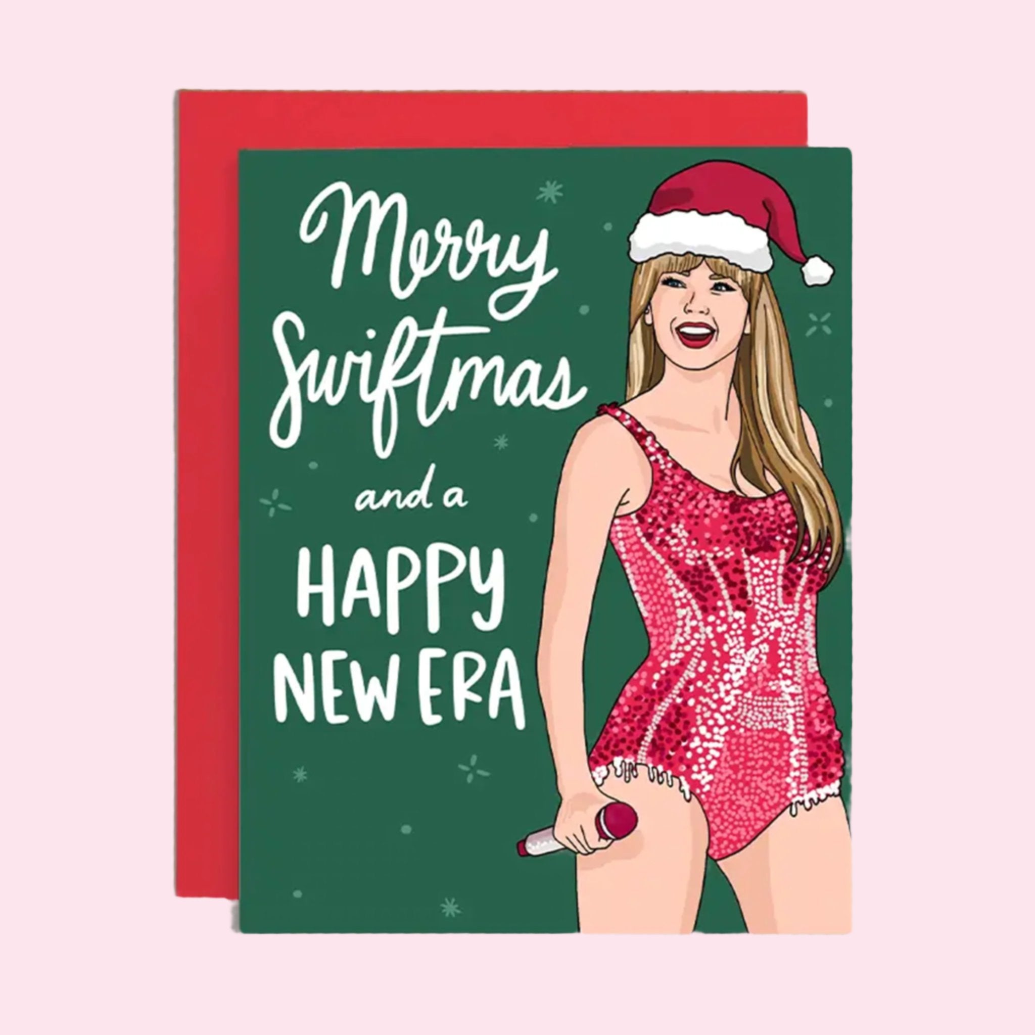 A green card with a graphic of Taylor Swift and text that reads, 'Merry Swiftmas and a Happy New Era'. 
