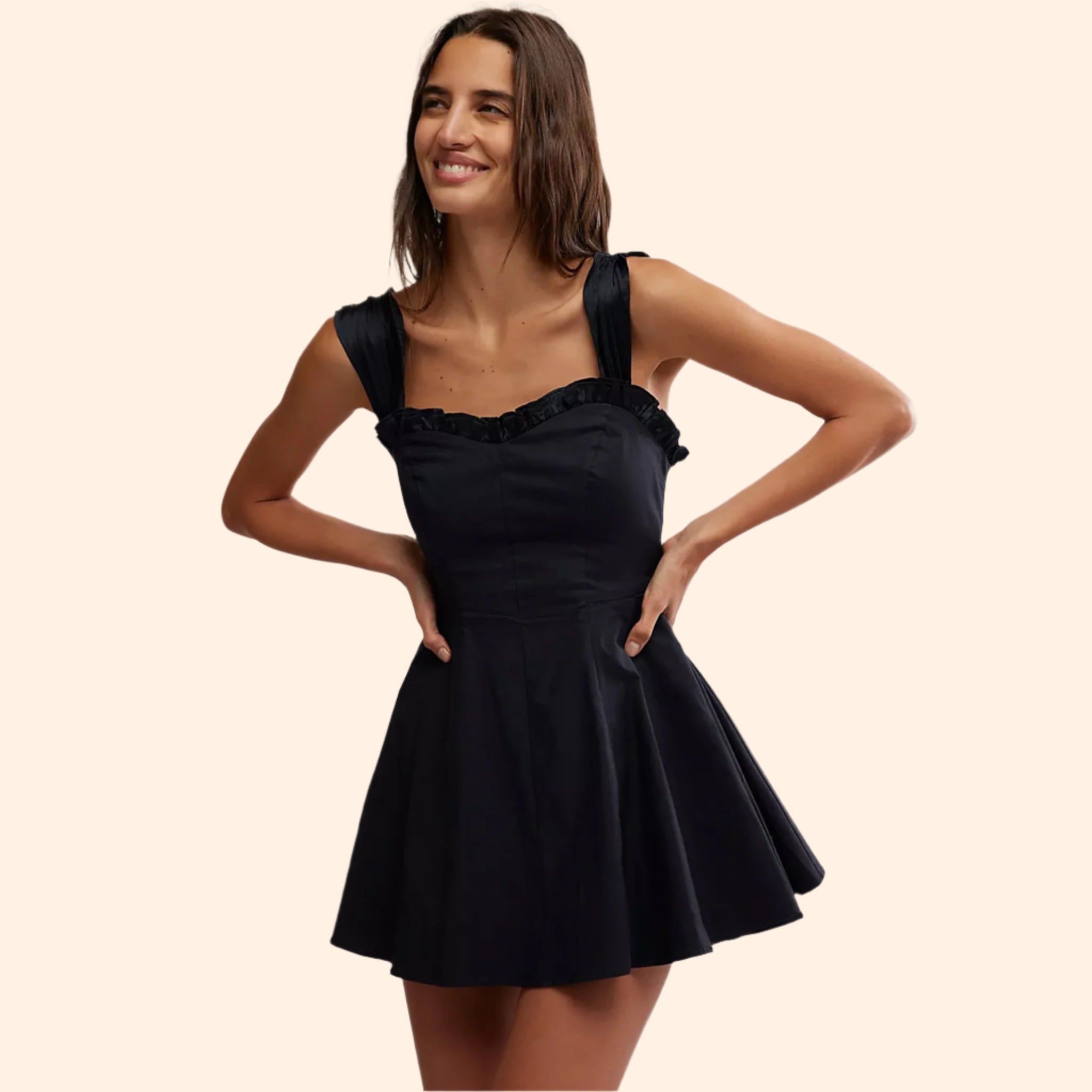 A black mini dress with straps. 