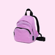  A cool toned pinkish purple mini nylon backpack with black straps and details. 