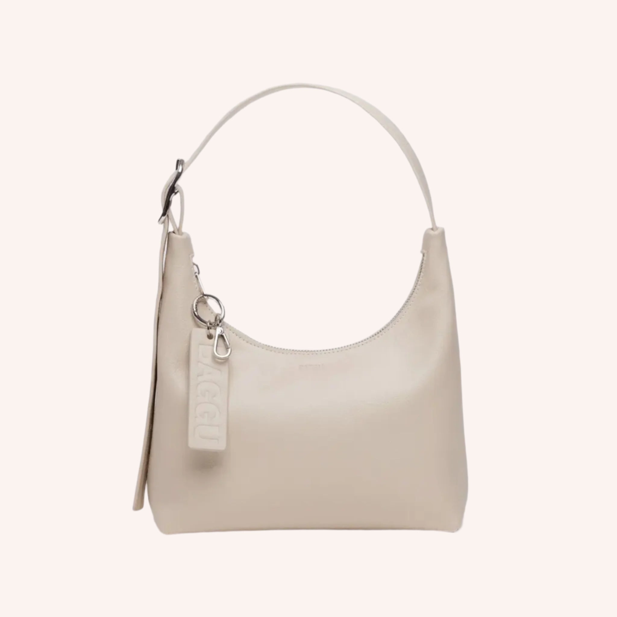 A cream colored leather handbag with an adjustable shoulder strap. 