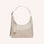 A cream colored leather handbag with an adjustable shoulder strap. 