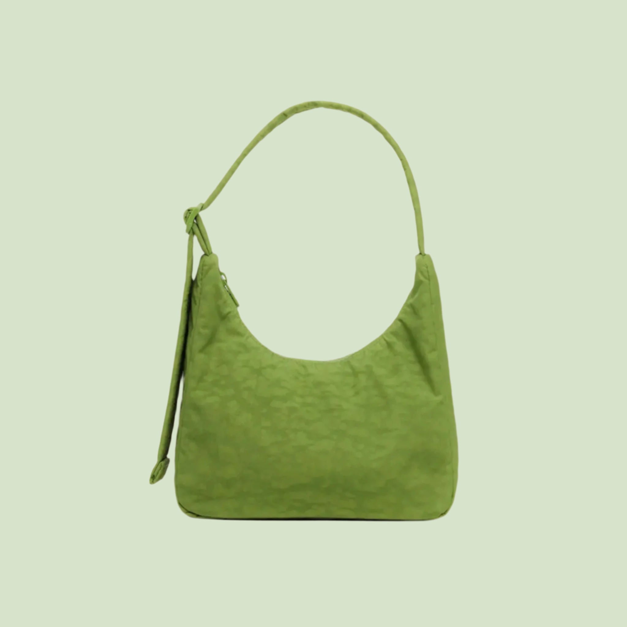 A green mini nylon shoulder bag. 