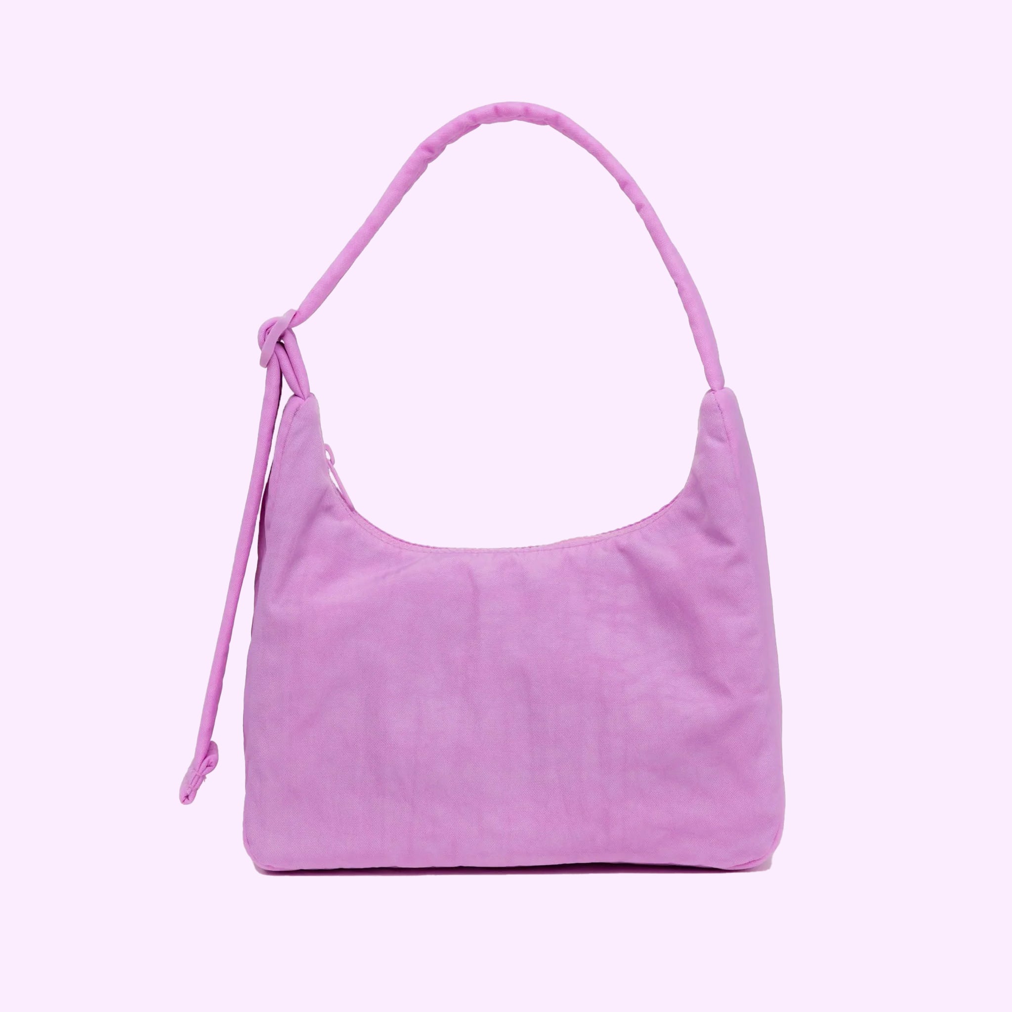 A mini pink nylon handbag with a squared shape and shoulder strap. 