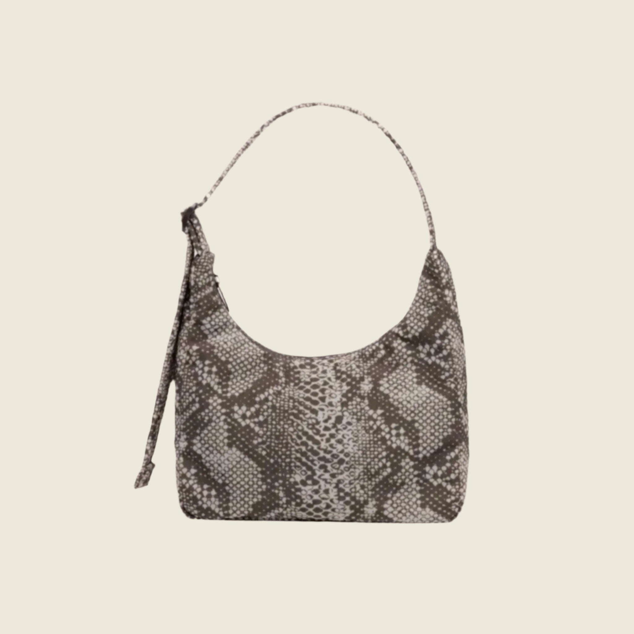 A nylon mini shoulder bag with an adjustable strap and a snakeskin print. 