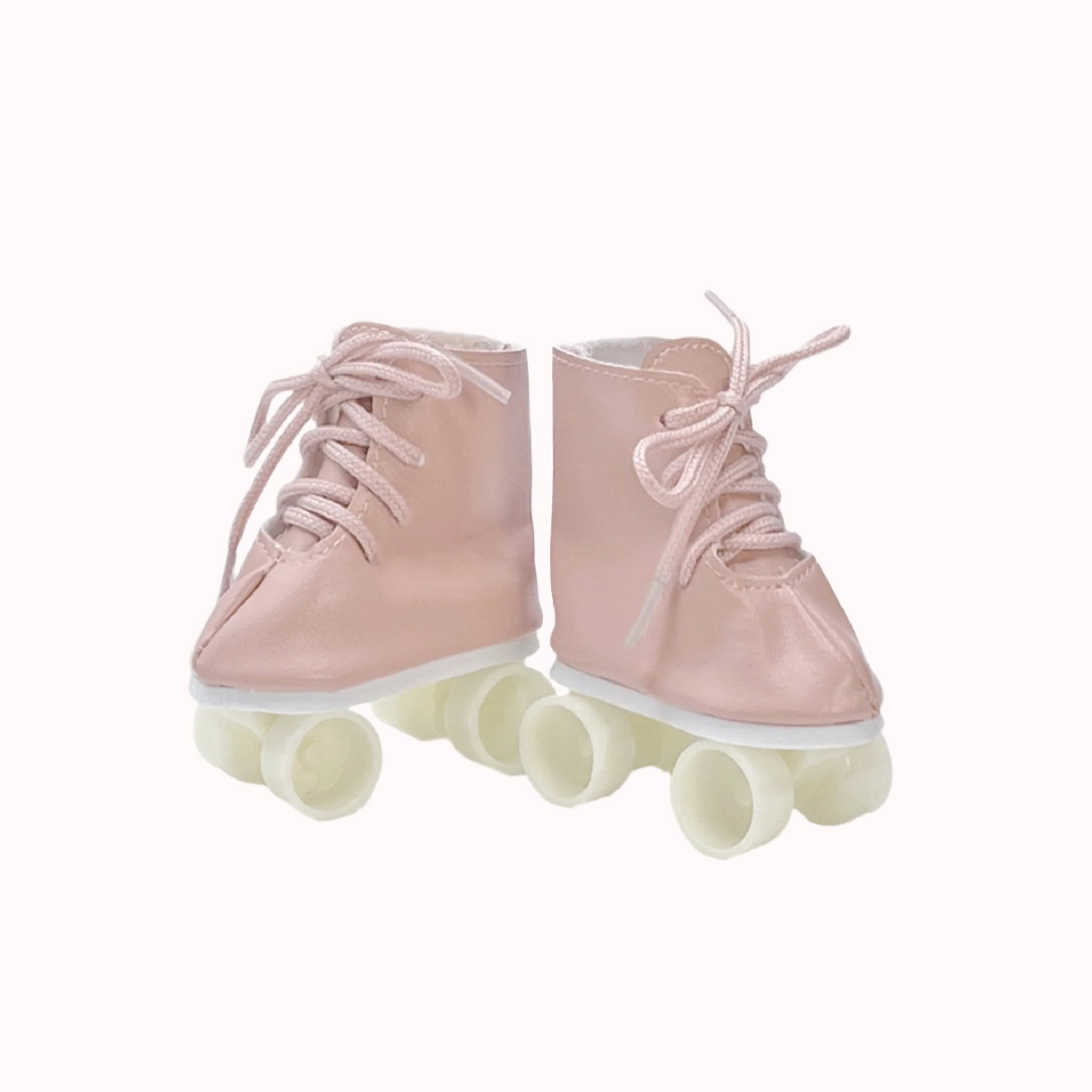 A pair of pink mini roller skates made for Minkane dolls. 