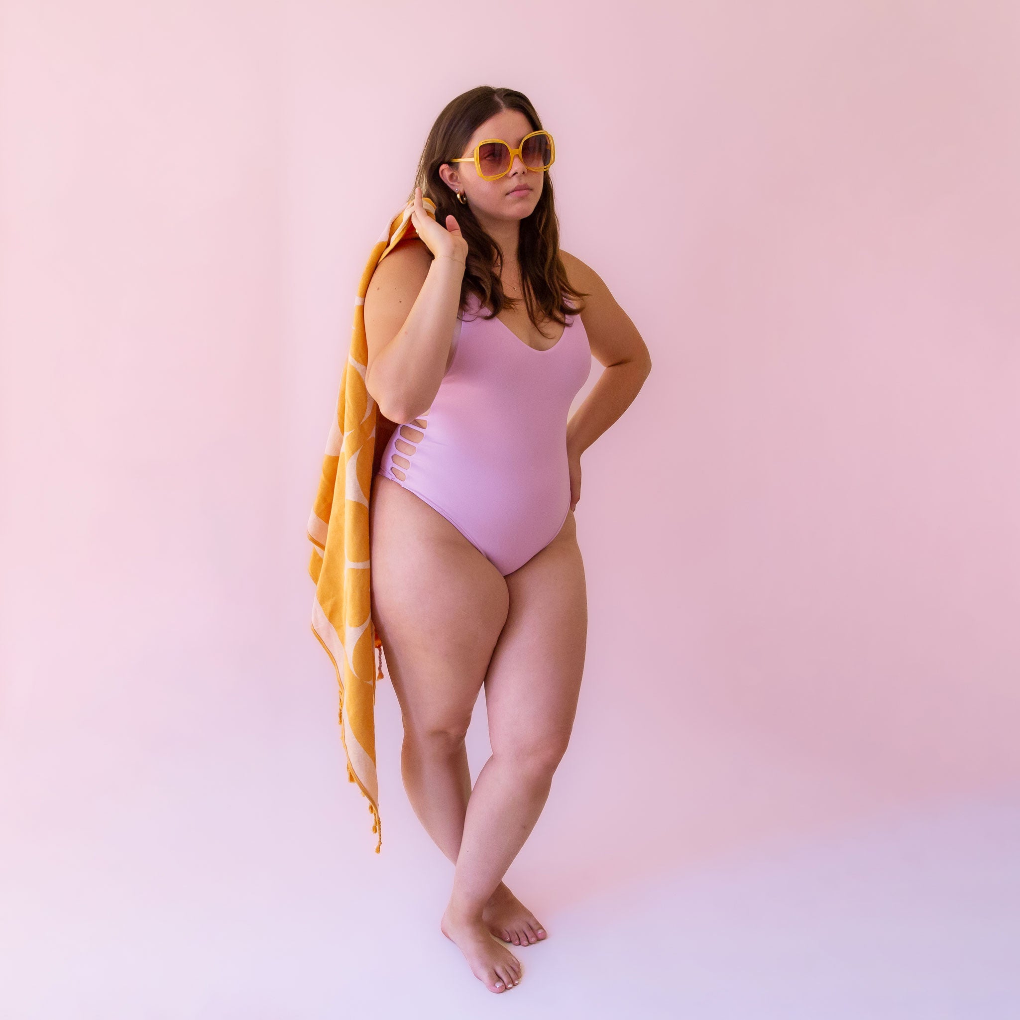 A lilac purple spaghetti strap one piece swimsuit. 