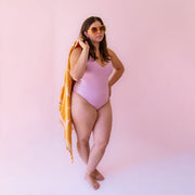 A lilac purple spaghetti strap one piece swimsuit. 