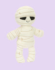 A mummy shaped stuffed toy. 