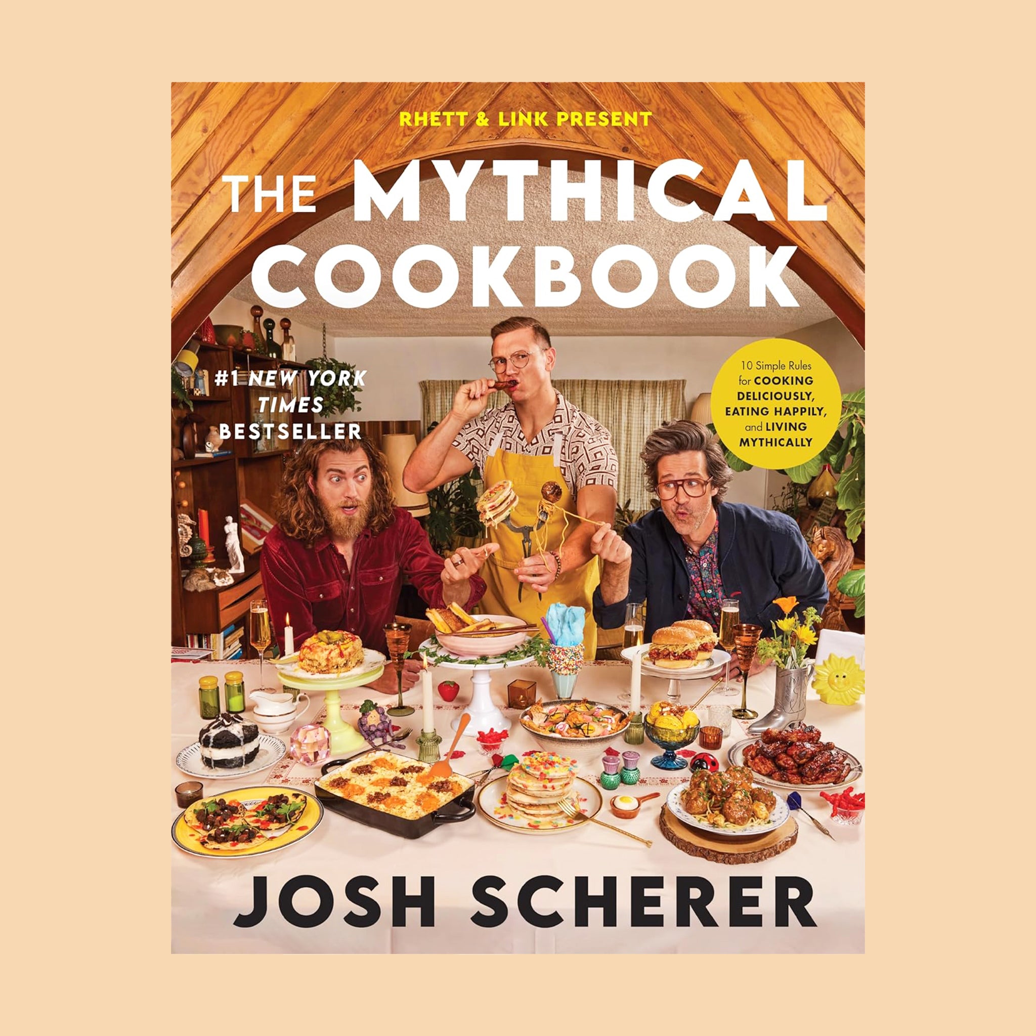 'The Mythical Cookbook #1 New York Times Bestseller' with a photo of a table scape filled with different dishes. 