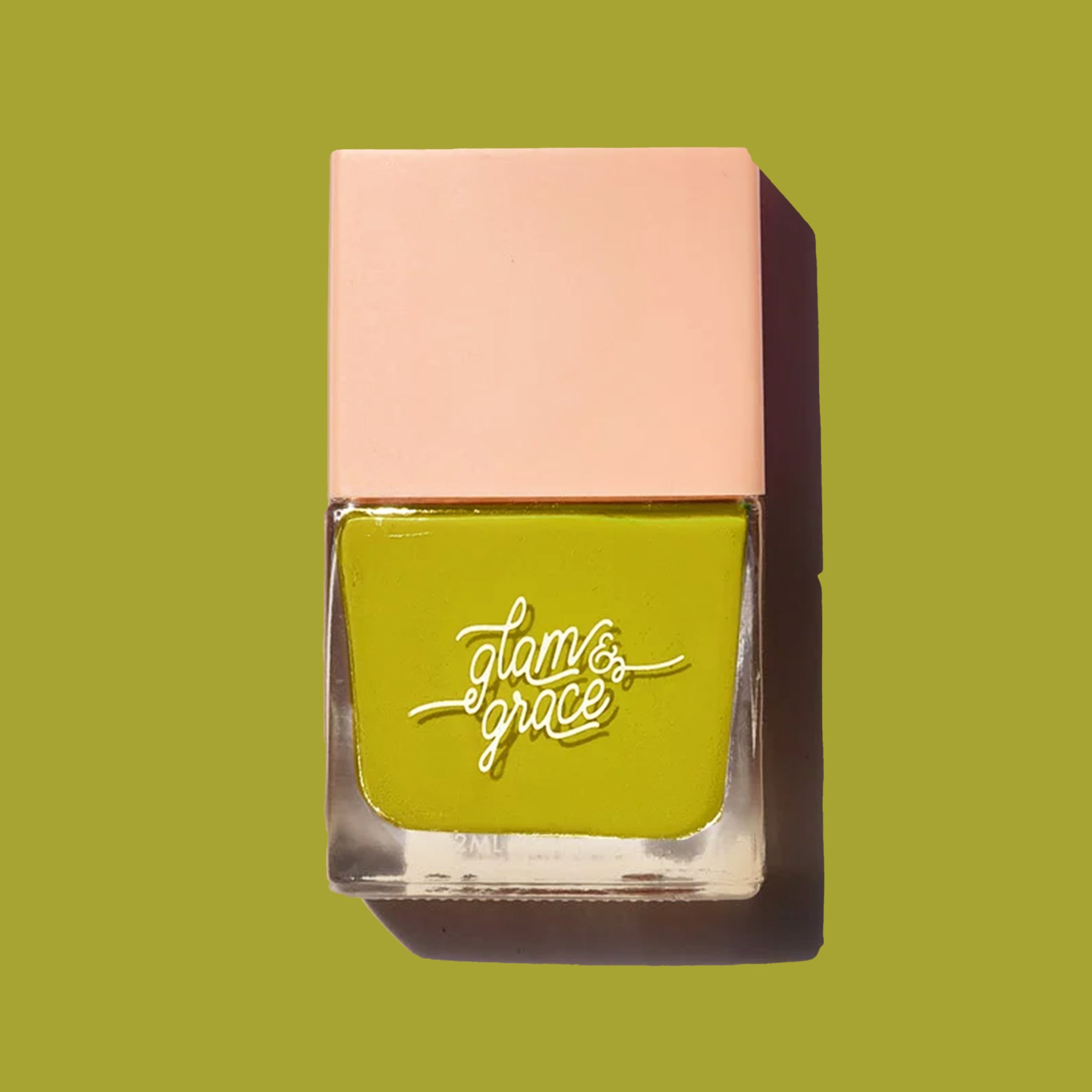 A square bottle of green nail polish. 