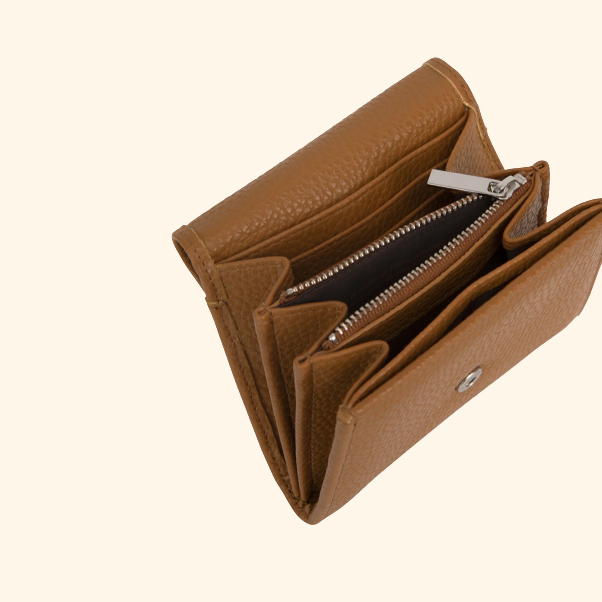 A brown wallet that also turns into a crossbody with a removable strap. 