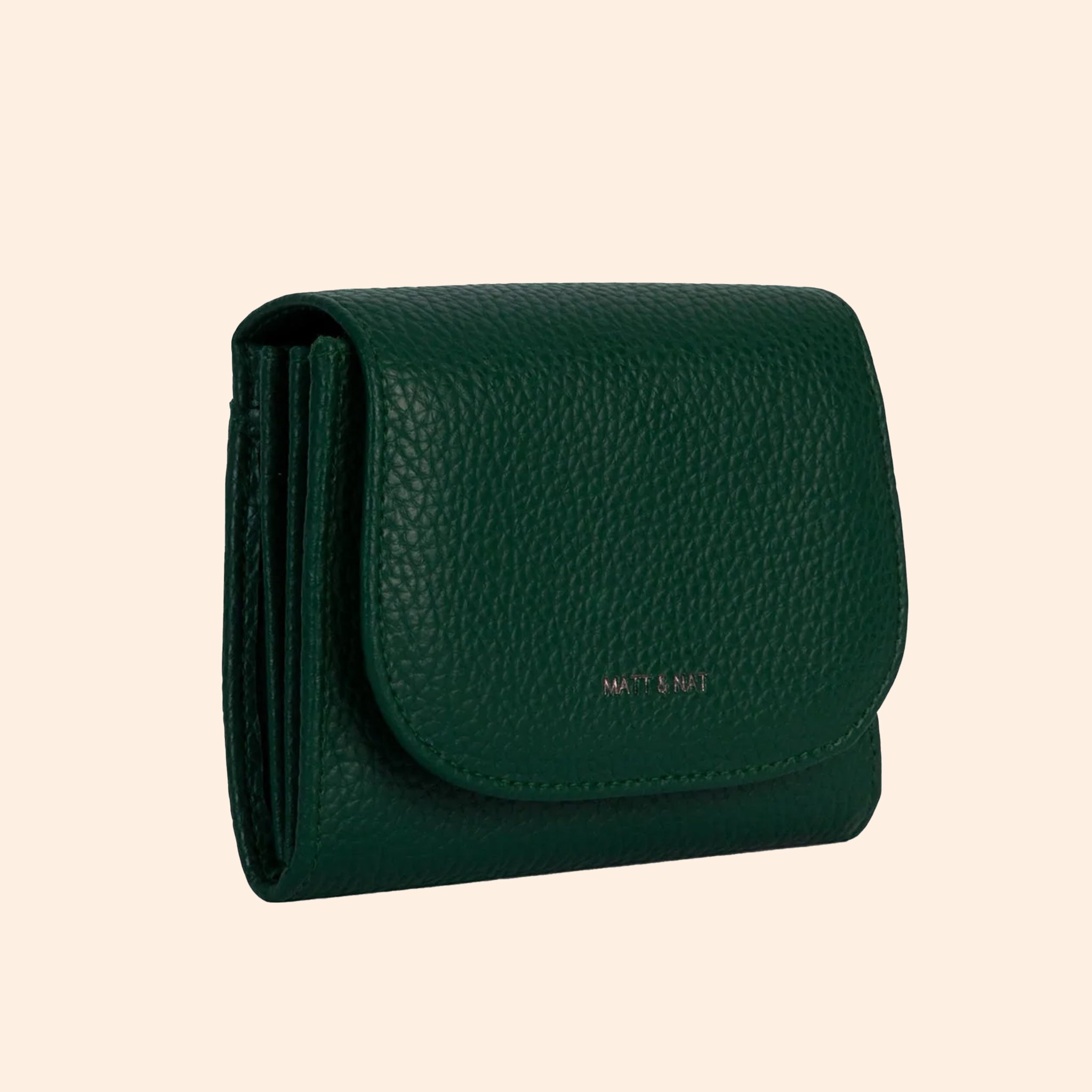 A dark green wallet with a removable crossbody strap. 