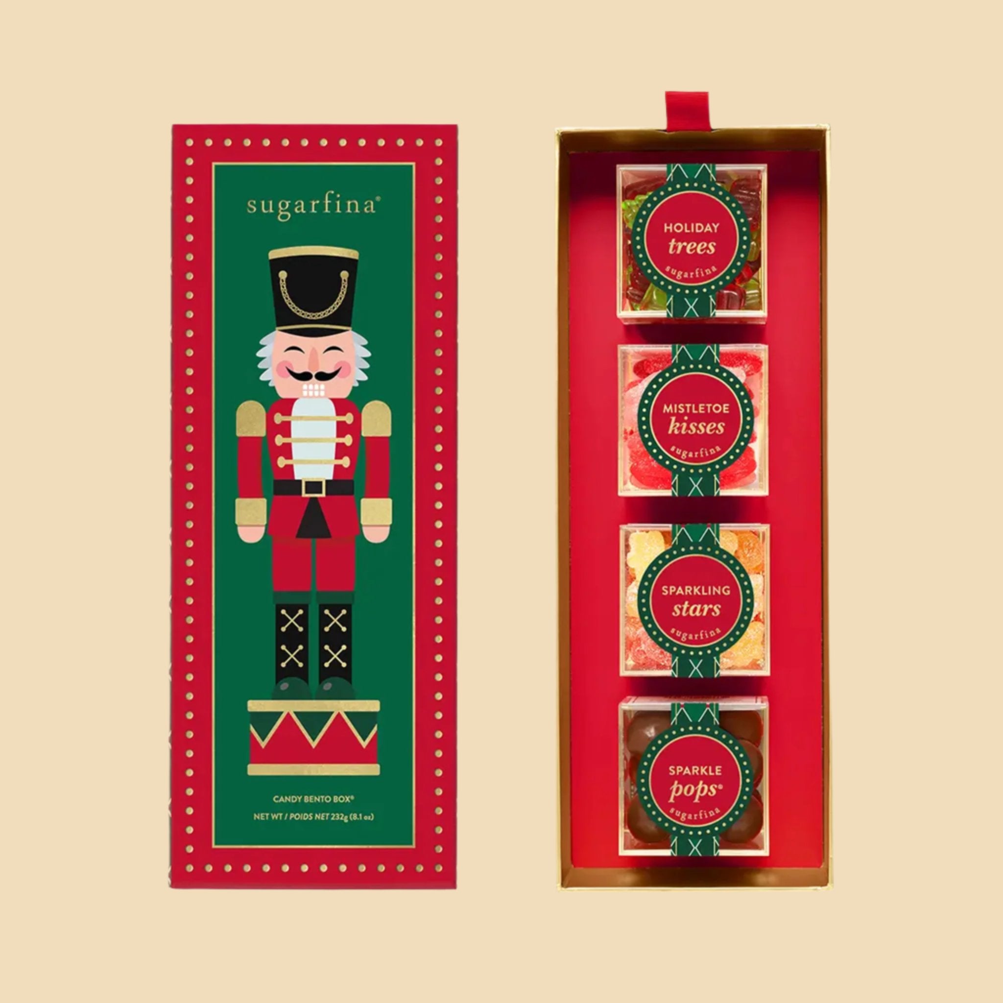 A box of four acrylic boxes of candy with a nutcracker graphic on top. 
