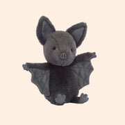 A black bat stuffed animal toy. 