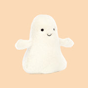 A ghost shaped stuffed toy. 