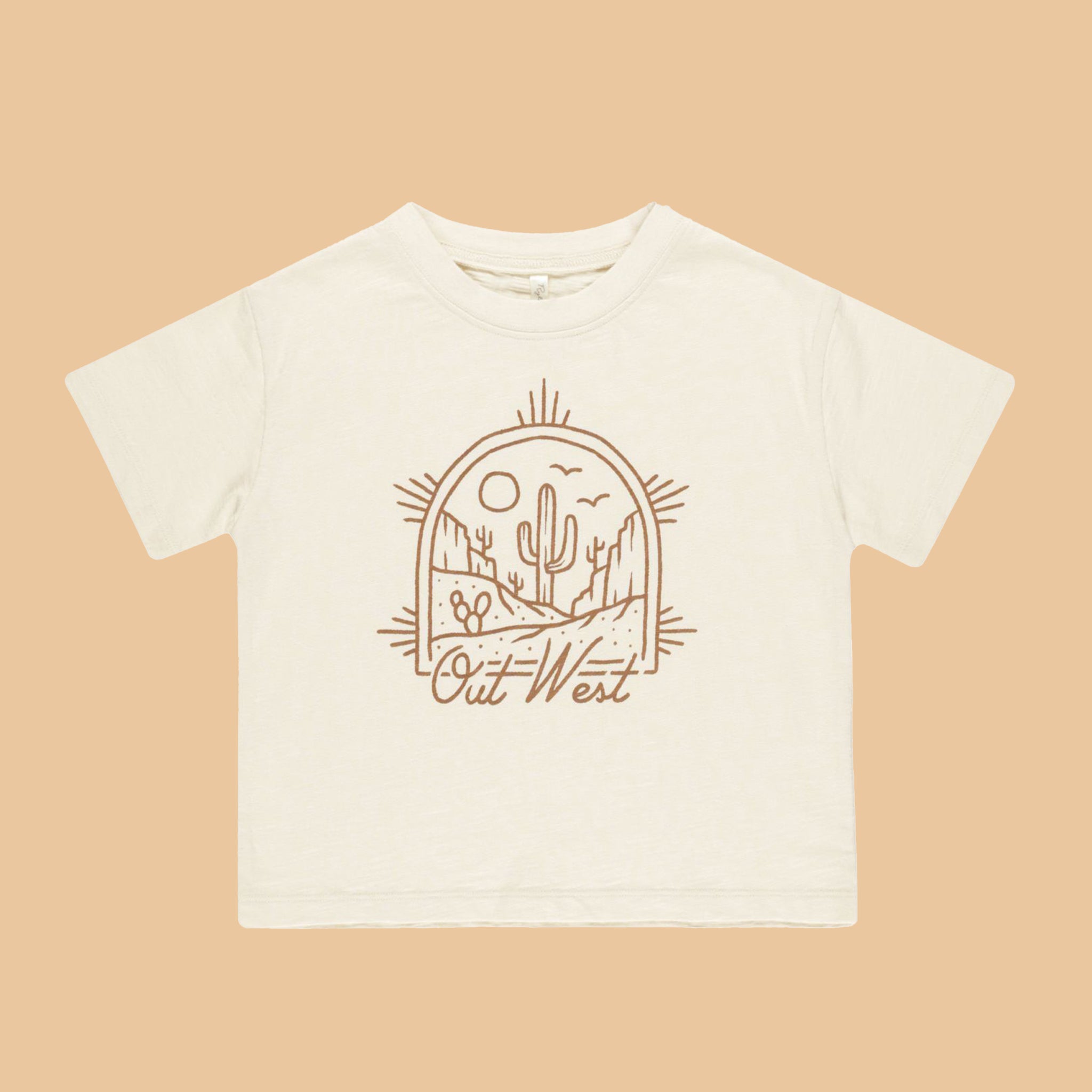 An ivory t-shirt for children with a brown western graphic on the front that reads, &quot;Out West&quot;. 